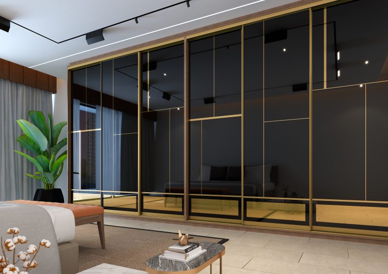 A modern bedroom featuring large sliding wardrobe doors with black frames and gold accents.